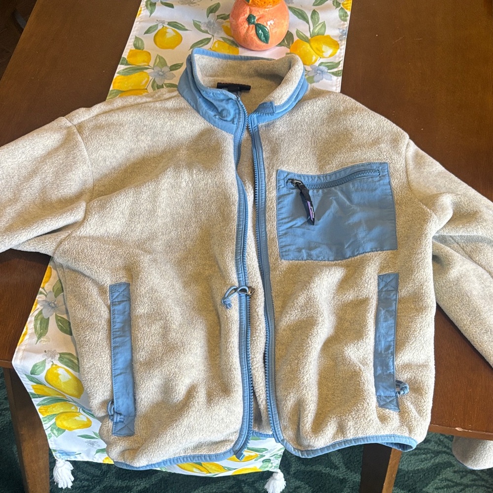 Patagonia Cream Fleece Jacket with Light Blue Trim and Pocket